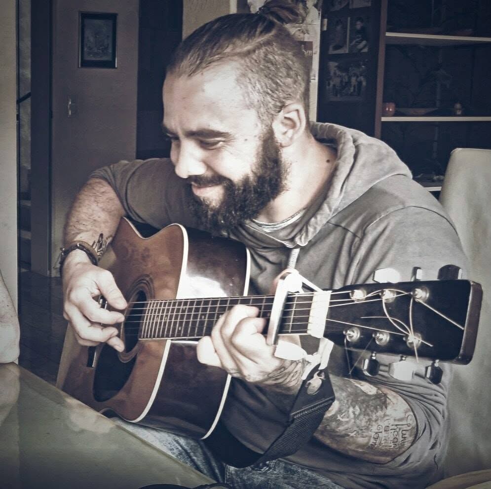 Roman playing acoustic guitar