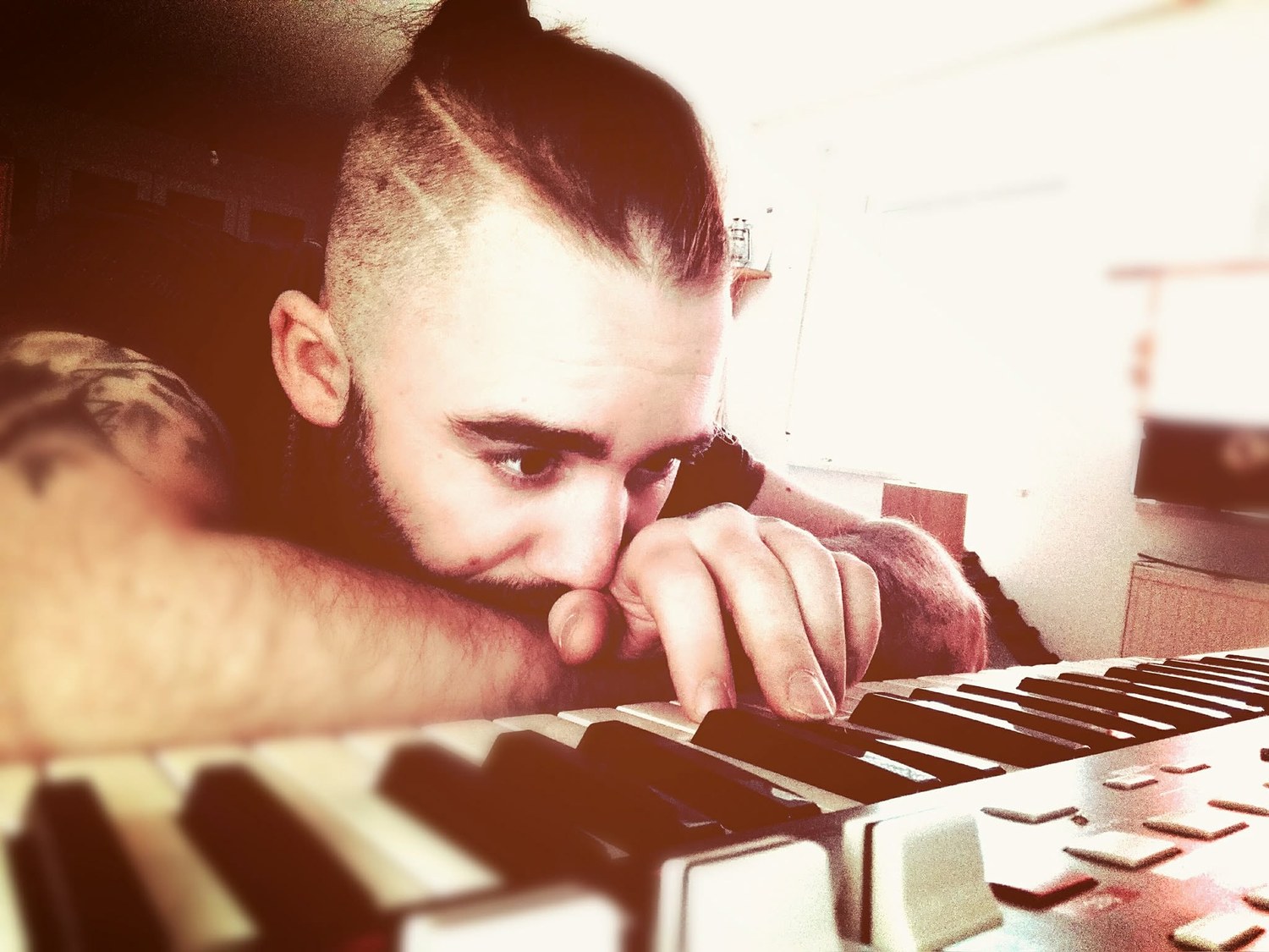 Roman working at a keyboard